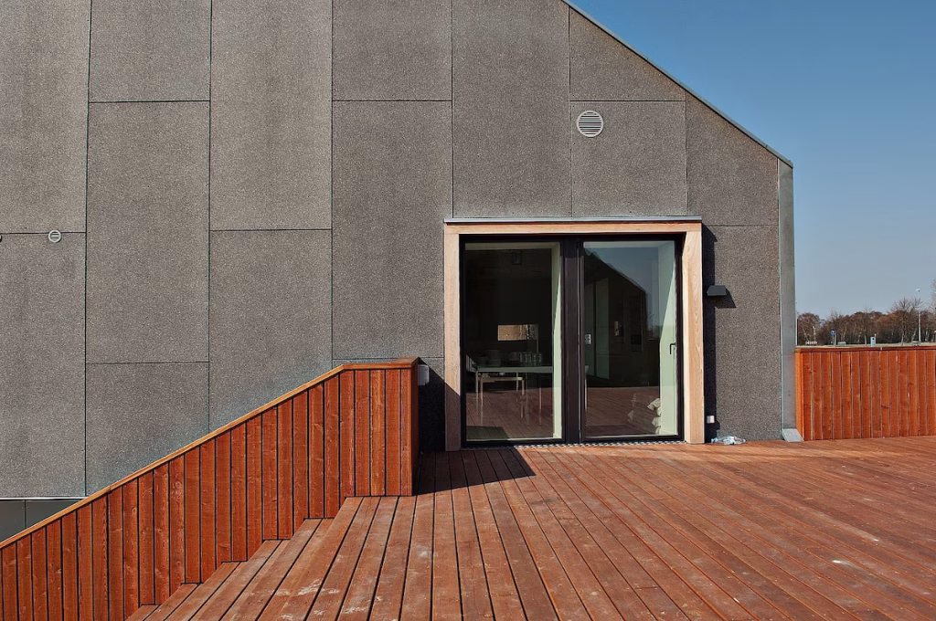 Fachada con paneles de cemento madera AMROC